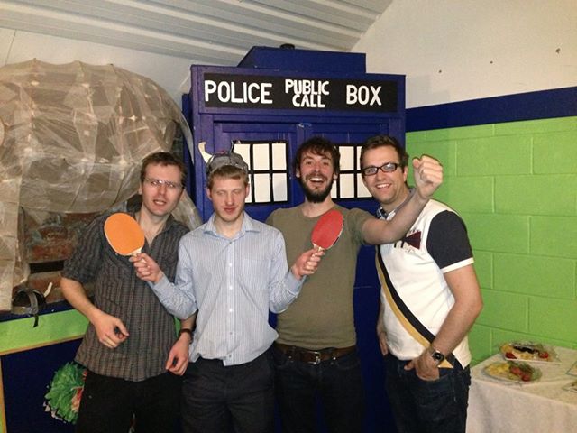 Photo of The Young'uns and Sam Carter wearing Viking Helmets, holding table tennis rackets, standing next to a TARDIS and huge ornamental elephant