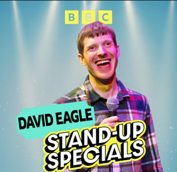 A light blue background with David smiling and holding a microphone. The words BBC David Eagle and stand-up specials appear across the image.